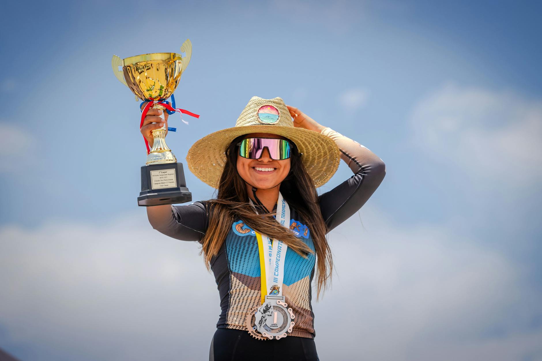 Smiling Sportswoman with Medals and Golden Trophy