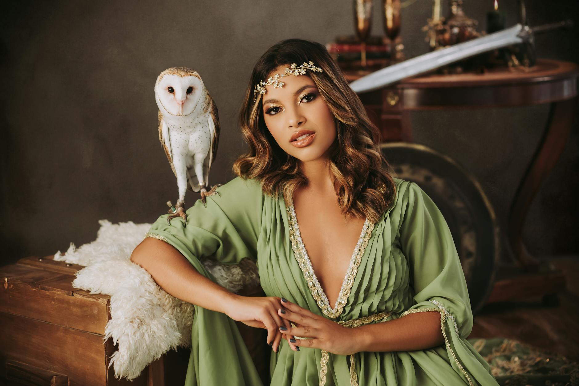 Portrait of Woman in Green Clothes and with Owl Figurine