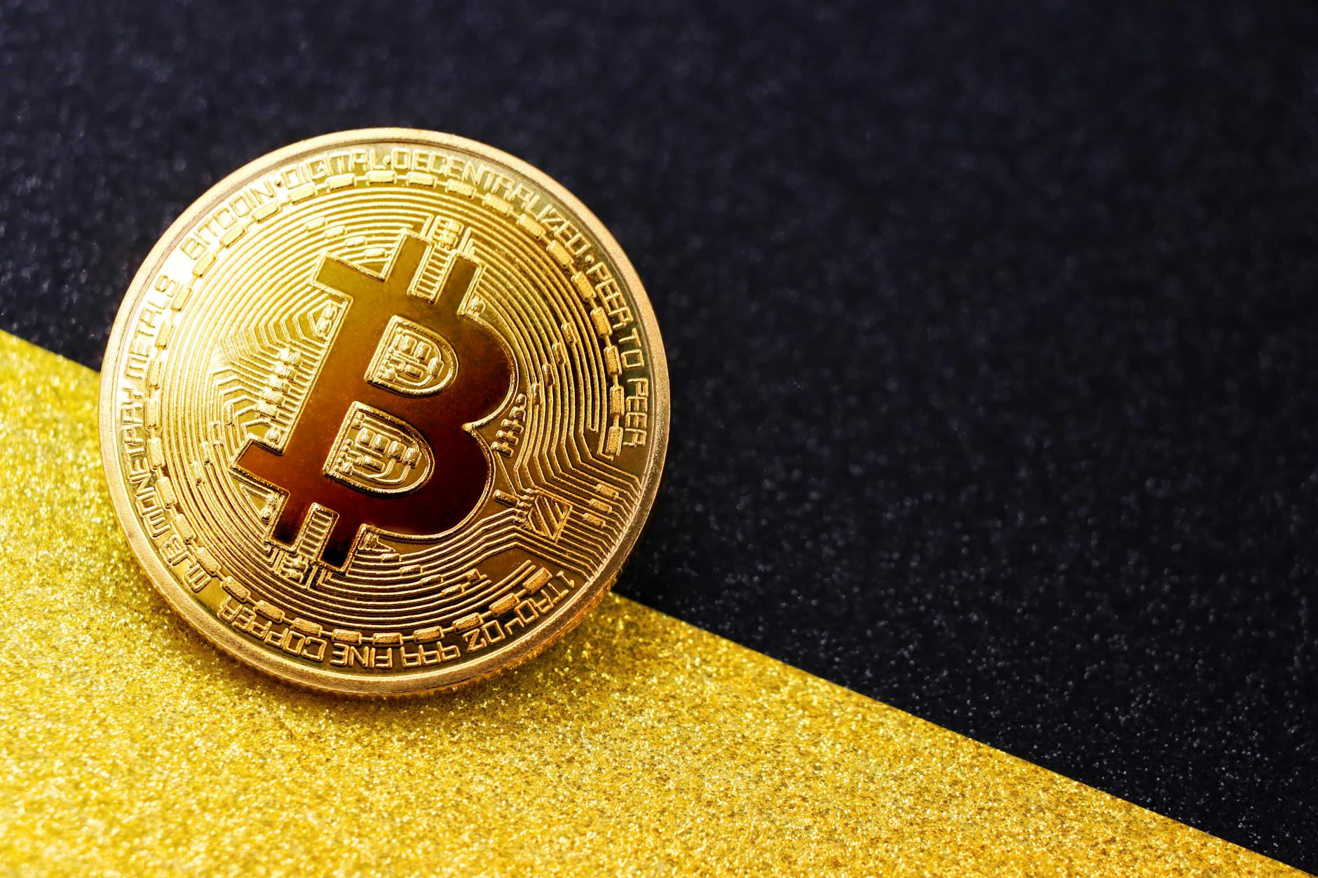 Close-up of a Bitcoin on a Black-Gold Background