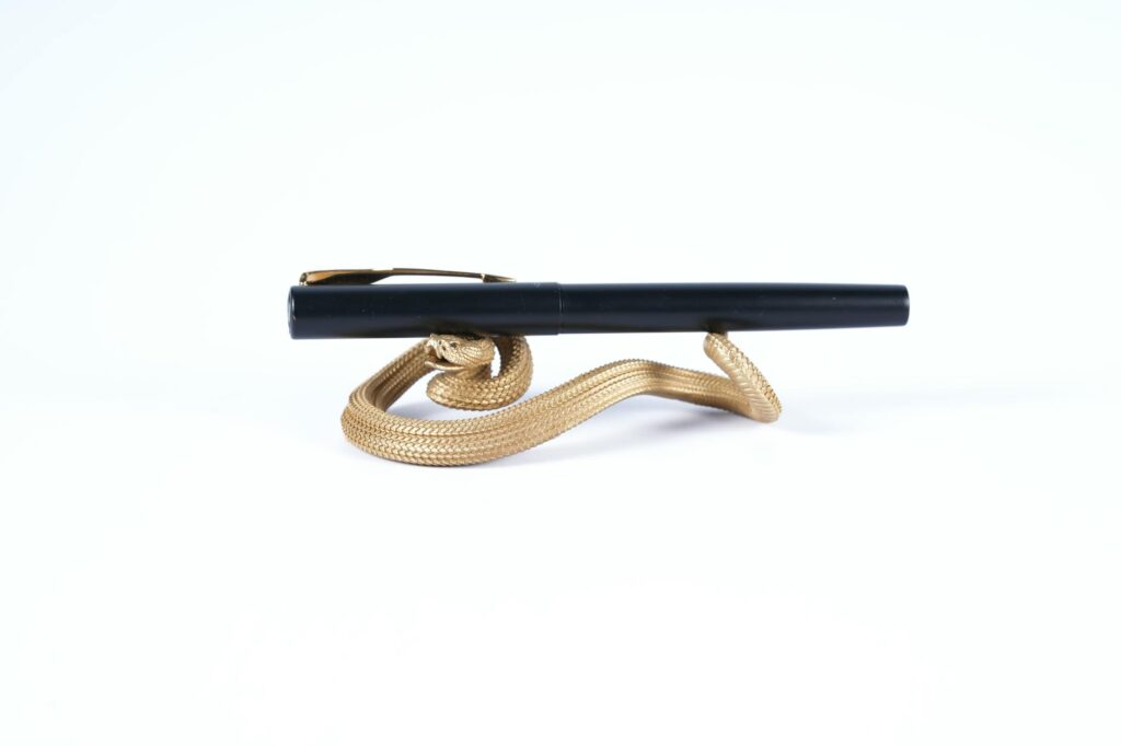 A Quill Pen on a Holder in the Shape of a Snake